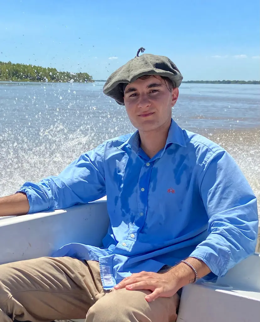 Felipe sales team member on boat at Golden Dorado Lodge Argentina