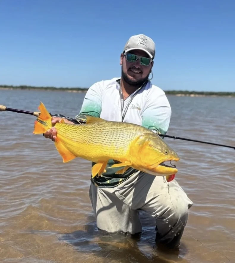 Lucas golden dorado fishing guide with trophy fish in Argentina