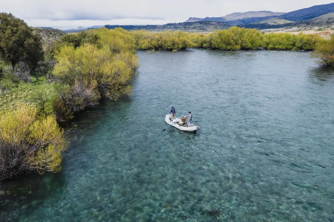 Aerial view of anglers drift boat fishing in Patagonia river
