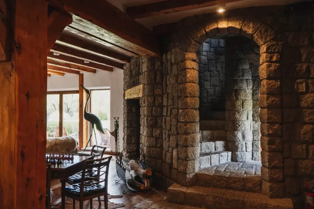 Billiard table in rustic game room at Stone River Lodge