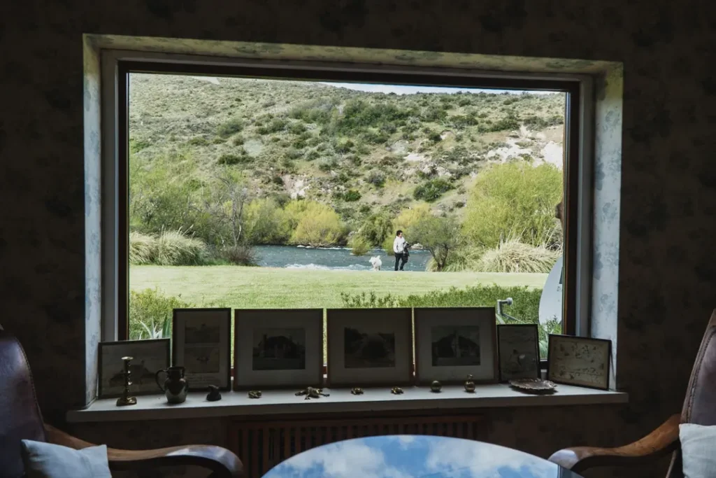 Luxury bedroom interior with wooden beams at Stone River Lodge