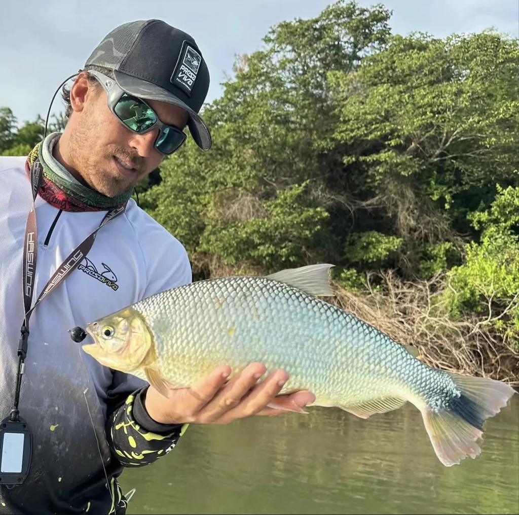 Angler holding golden dorado trophy fish at Golden Dorado Lodge