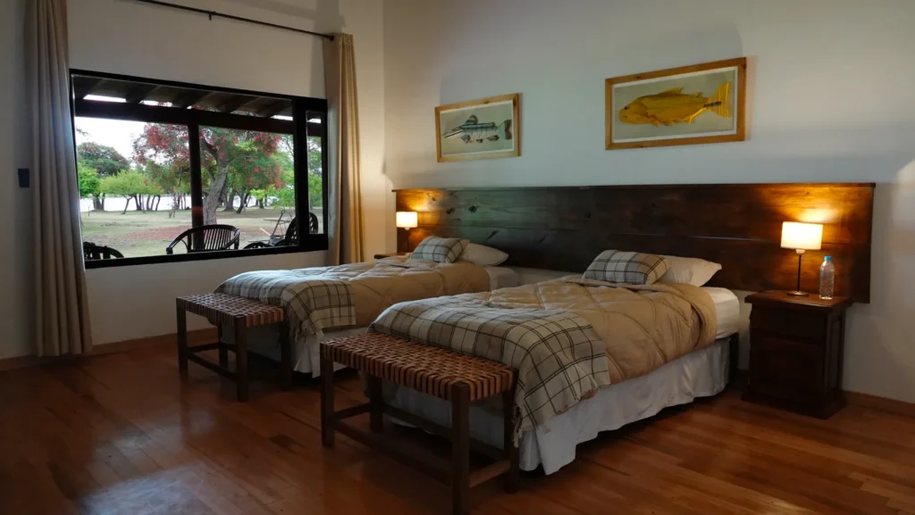 Comfortable bedroom suite with view at Golden Dorado Lodge