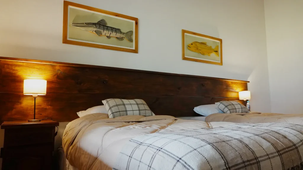 Spacious living room lounge area with sofas at Golden Dorado Lodge