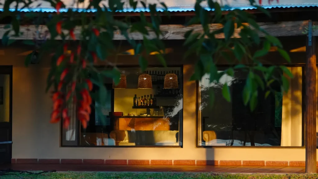 Illuminated exterior of Golden Dorado Lodge at twilight
